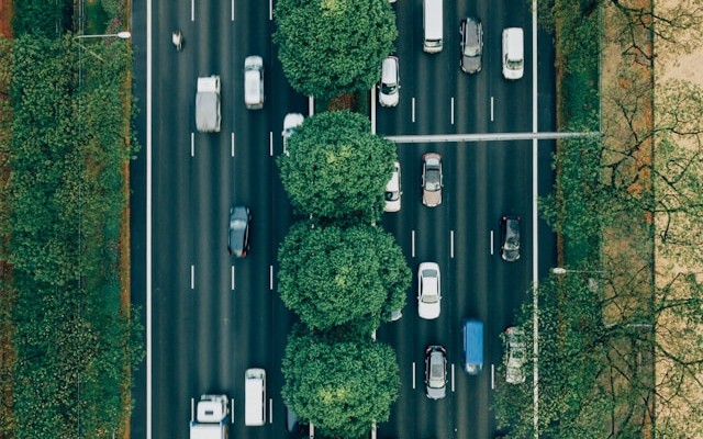 Dashboard showing gRPC service latency spiking during traffic burst, with queue depth climbing and throughput collapsing